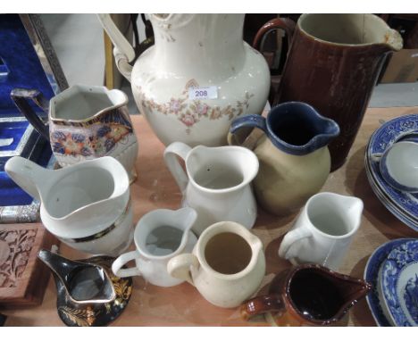 A selection of ceramic jugs including Gilson ware etc