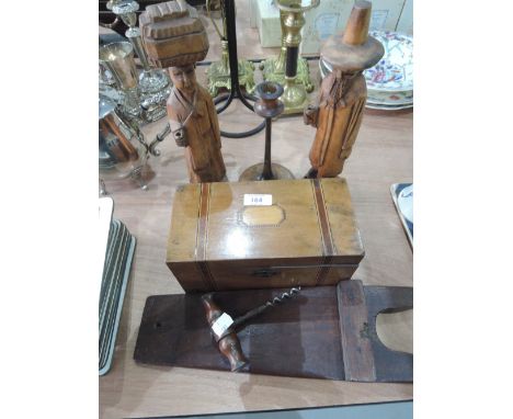 A pair of treen figures, antique corkscrew, bootjack and 19C caddy