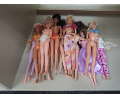 Fourteen Mattel and similar Barbie and Sindy dolls