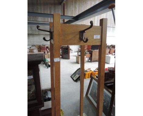 A vintage golden oak coat stand