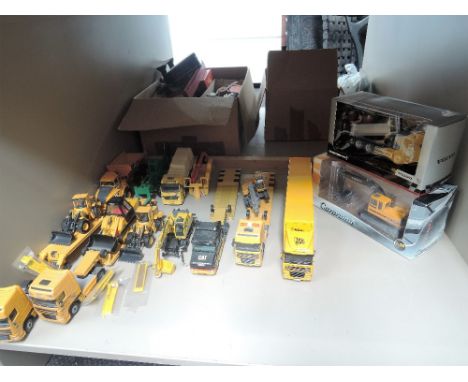 A shelf of die-cast contractors vehicles including Corgi, Joal, Cararama etc