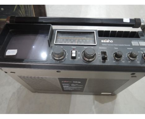 A vintage battery operated SAISHIO TCR television radio cassette recorder