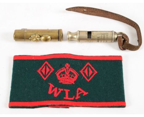 A WWI period nickel plated whistle by A DeCoucy & Co Birmingham, stamped '1917':, suspended on a brown leather frog, together