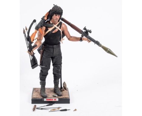 A loose Enterbay 1/4th scale Rambo III figure: with a small collection of accessories. .