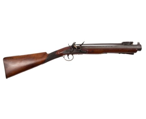 A late 18th century flintlock blunderbuss by T Jones:, the 14 1/2 inch steel barrel with proof marks mounted with spring load