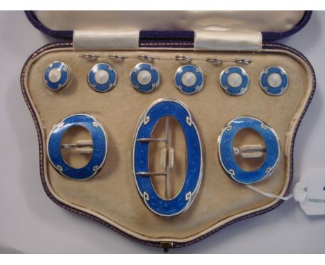 A cased set of silver and blue and white enamel buckles and buttons:, comprising a shaped oval buckle, Birmingham 1911, 75mm 