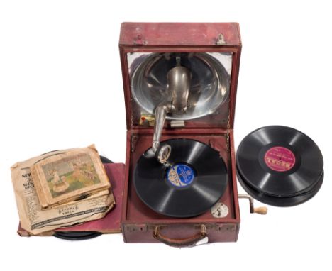 A red leather cased Decca portable wind-up gramophone: and quantity of 78rpm records.