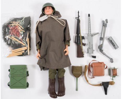 A Palitoy Action Man painted head Command Post Soldier:,  full uniform with rain poncho, machine guns and accessories. 