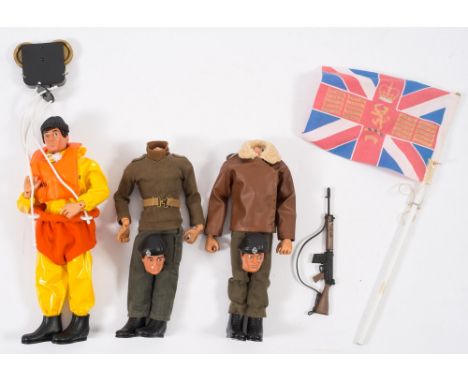 A Palitoy Action Man flock hair RNLI figure in breeches bouy:, together with a Tank Commander and Soldier. (both heads loose,