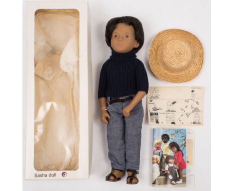 A Sasha 'Doll 'Gregor Dar Denims' No 301:, vinyl body with black hair, painted face, dressed in blue jumper and jeans with be