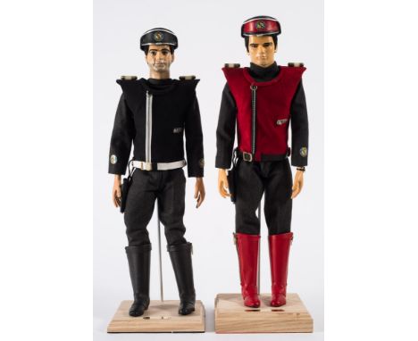 Two large scale figures of 'Captain Scarlet' and 'Captain Black':, both on wooden stands with brass name plaques. 54cm high.