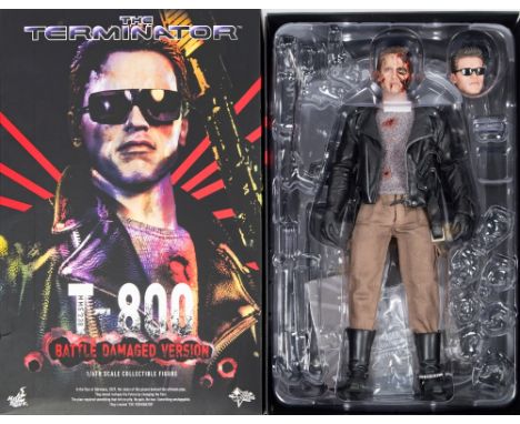 A Hot Toys 1/6th scale Terminator figure 'T-800 Battle Damaged Version':, boxed, ( incomplete) and another empty box. 