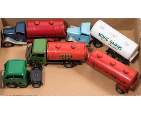A Tri-ang Minic clockwork articulated tanker in 'Shell BP Fuel Oil' livery:, another tanker in 'BP' livery and two other tank