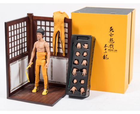 A Hot Toys 1/6th scale Bruce Lee 'Enter the Dragon' figure DX04:, together with an Enterbay  Bruce Lee 'Game of Death' figure