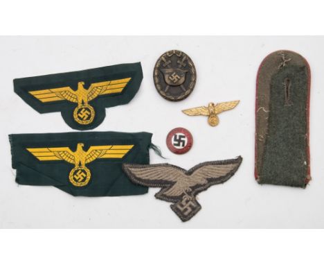 A Third Reich Period Wound badge:, together with a gilt lapel badge, an enamel NSDAP badge, three cloth badges and an epaulet