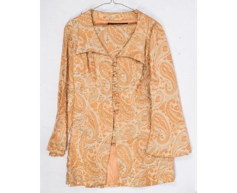 An orange and gold paisley trouser suit by Hilary Floyd, London:, size 14.*Notes- Designing clothes since the 1960s, in the 1