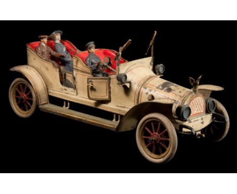 An early tinplate clockwork open top tourer, possibly by Carette:, in cream with red and gold coach lines, hand painted baked