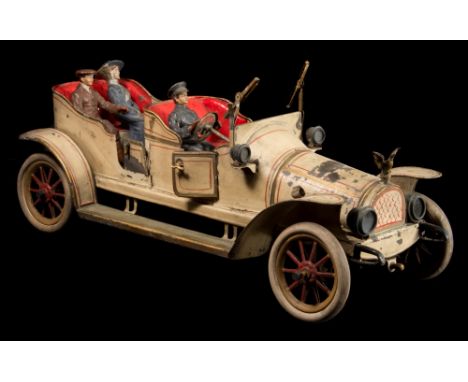 An early tinplate clockwork open top tourer, possibly by Carette:, in cream with red and gold coach lines, hand painted baked