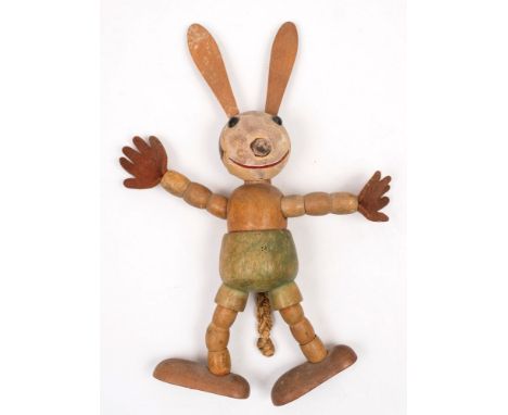 An early 20th century Oswald The Lucky Rabbit wooden articulated toy by Dean's Rag Doll Co , London:, large wooden ears over 