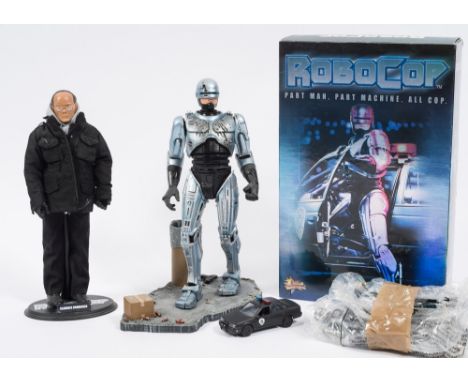 A 1/6th scale Robocop figure, together with a 'Clarence Boddicker' figure:, an empty Hot Toys Robocop box and a group of smal