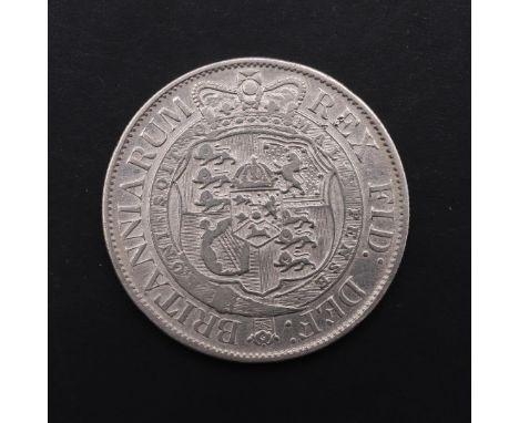 A GEORGE III HALFCROWN, 1818. A George III Halfcrown, smaller laureate head r. with date 1818, reverse with crowned garter an