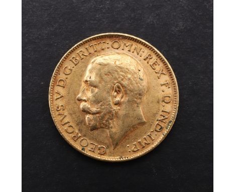 A GEORGE V SOVEREIGN, 1913. A George V Sovereign, bare head l. reverse St George and the Dragon, dated 1913. *CR  Light surfa