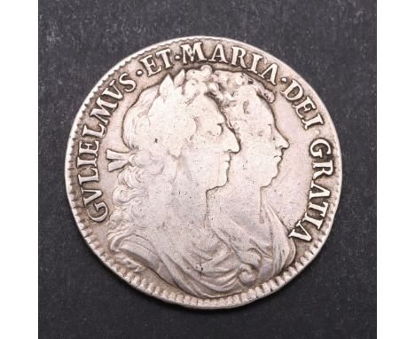 A WILLIAM AND MARY HALFCROWN, 1690. First busts r. Reverse with second crowned shield, dated 1690. Rim Secundo. *CR  Some rub