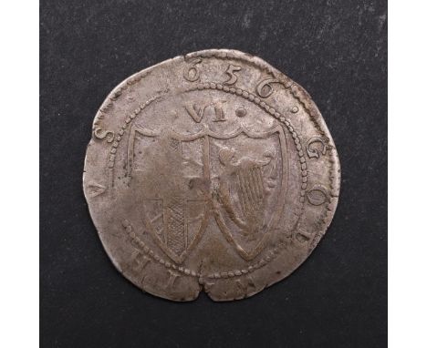 A COMMONWEALTH SIXPENCE, 1656. St George's Cross in a shield and wreath, mint mark sun, reverse with cross of St George and I