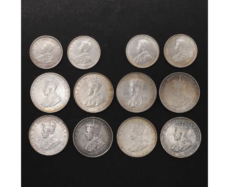 A COLLECTION OF BRITISH WEST AFRICA COINS, TWO SHILLINGS AND ONE SHILLING PIECES. British West African Two Shillings, Crowned