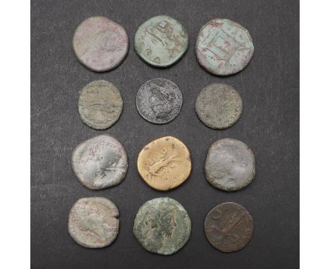 A COLLECTION OF TWELVE ROMAN COINS, LARGER DENOMINATIONS TO INCLUDE SESTERTIUS OF ANTONINUS PIUS. A brass Sestertius of Anton