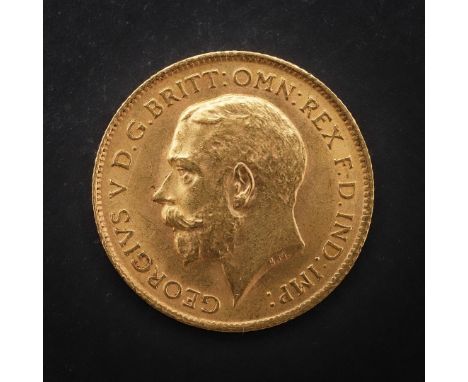 A GEORGE V HALF SOVEREIGN, 1913. A George V Half Sovereign, bust l. St George and the Dragon reverse, dated 1913. *CR  Light 
