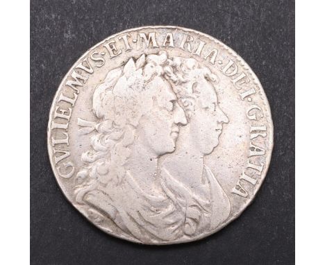 A WILLIAM AND MARY HALFCROWN, 1689. First busts r. Reverse with first crowned shield, dated 1689. Rim Primo (unclear). *CR  S