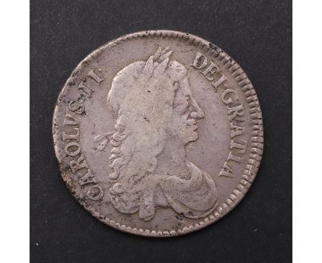 A CHARLES II HALFCROWN, 1663. A Halfcrown, first draped bust r. Revers with cruciform shields with interlinked C's in the ang