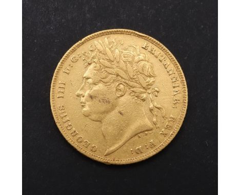 A GEORGE IV SOVEREIGN, 1823. A George IV Sovereign, laureate bust l, R. St George and the Dragon, dated 1823. *CR  Some surfa