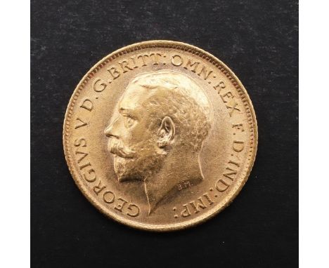 A GEORGE V HALF SOVEREIGN, 1913. A George V Half Sovereign, bust l. St George and the Dragon reverse, dated 1913. *CR  Light 