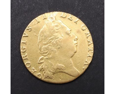 A GEORGE III GUINEA, 1798. Fifth laureate head, r. Reverse with crowned 'spade' shaped shield of arms, dated 1798. c. 8.27 g.