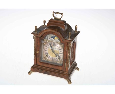 Warmink walnut brass mounted bracket style mantel clock with brass and silvered dial.