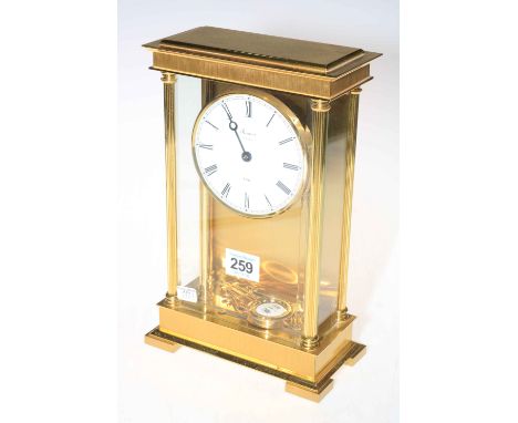 Rapport of London brass and glass mantel clock with enamel dial.