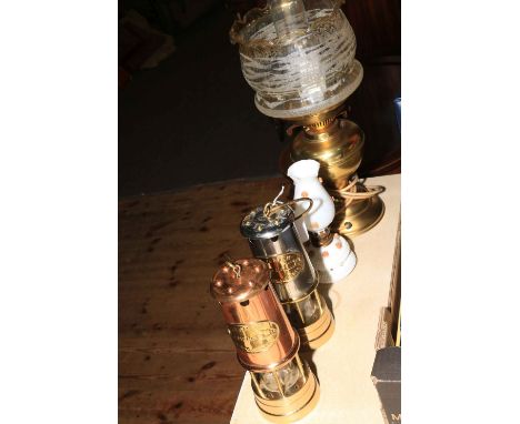 Two Beamish mahogany drift miners lamps, brass oil lamp and small lamp.