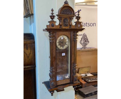 Victorian walnut Vienna style wall clock with enamelled and brass dial.