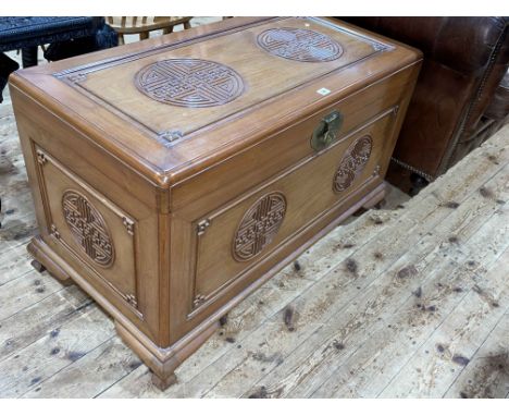 Oriental carved camphorwood trunk, 60cm by 103cm by 53cm.