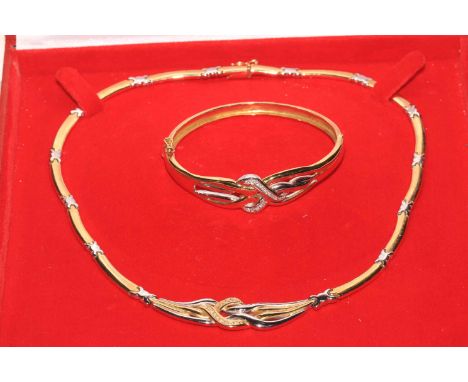 Two tone 18 carat gold and diamond link necklace and matching bangle.