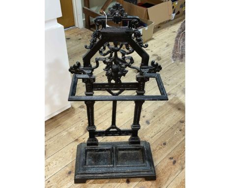 Cast iron arched top stick stand, 85cm by 43cm by 21cm.