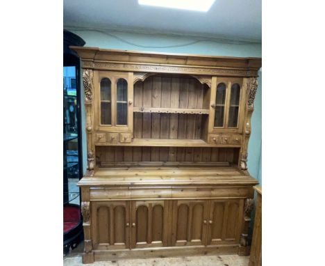 Continental pine dresser, the shelf back having two glazed panel doors and six drawers above a base of three drawers and four
