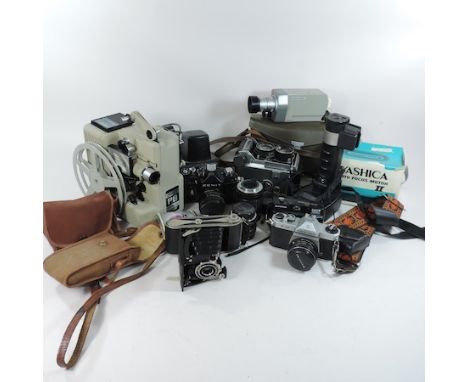 A collection of vintage cameras, to include a Pentax 53 and cine cameras