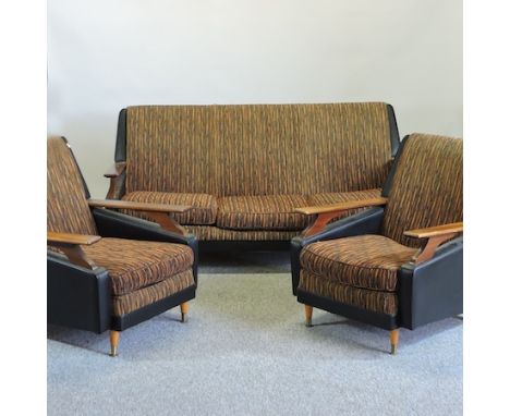 A 1970's teak and vinyl upholstered sofa, 168cm, together with a pair of matching armchairs