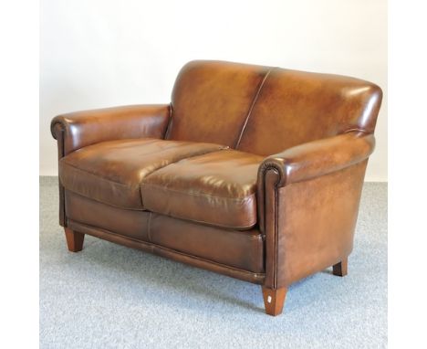 A Laura Ashley brown leather upholstered two seater sofa, 130cm