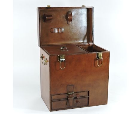 A brown leather champagne hamper, with a fitted interior, 34cm