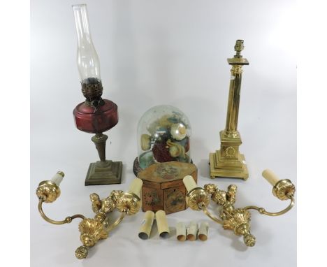 A brass table lamp, together with an oil lamp, a Victorian glass dome, a painted caddy and a pair of wall lights