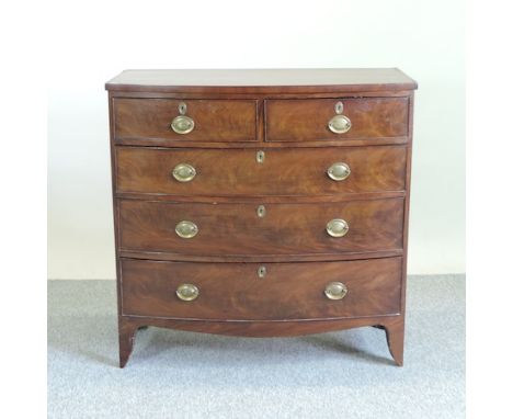 A Regency mahogany bow front chest, of two short over three long drawers, on bracket feet, 104cm